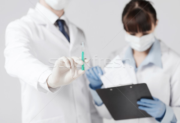 Stock photo: doctors with syringe