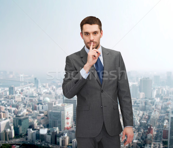 young businessman making hush sign Stock photo © dolgachov