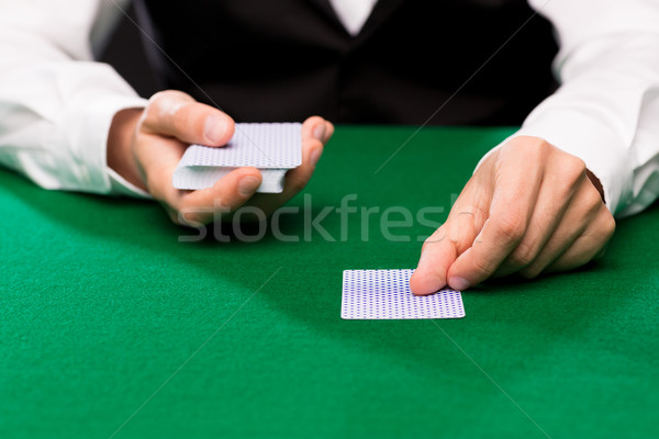 holdem dealer with playing cards Stock photo © dolgachov