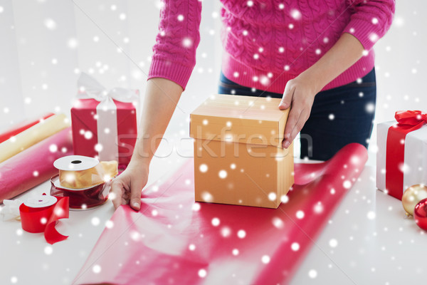 close up of woman decorating christmas presents Stock photo © dolgachov