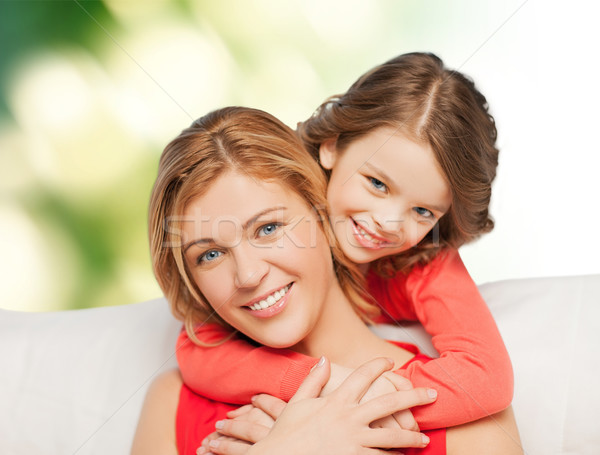 Stock photo: happy mother with daughter hugging and talking