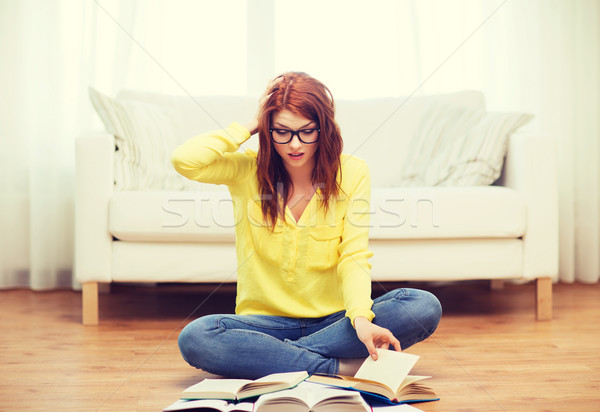 stressed student girl reading books at home Stock photo © dolgachov