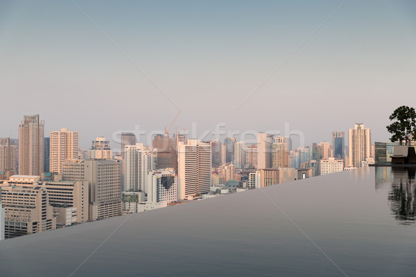 Vue infini bord piscine Bangkok ville [[stock_photo]] © dolgachov