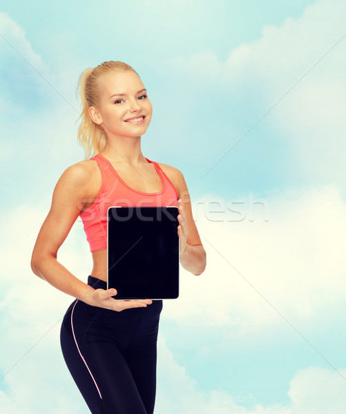 smiling woman showing tablet pc blank screen Stock photo © dolgachov