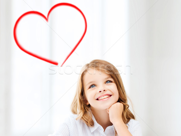 smiling little student girl drawing at school Stock photo © dolgachov