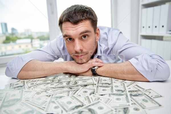 Boldog üzletember halom pénz iroda üzletemberek Stock fotó © dolgachov