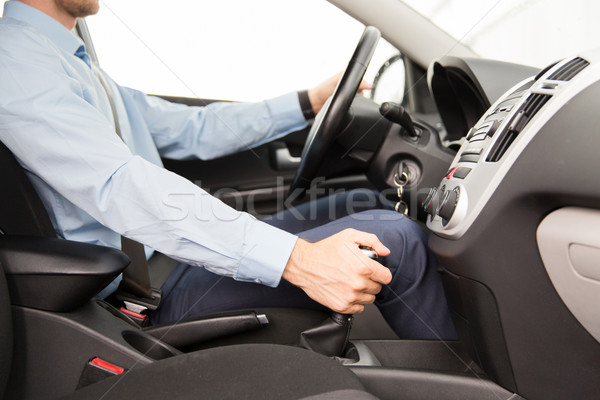 close up of young man driving car Stock photo © dolgachov