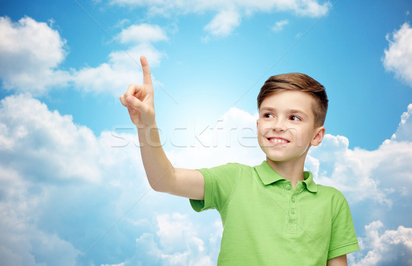 happy boy in green polo t-shirt pointing finger up Stock photo © dolgachov