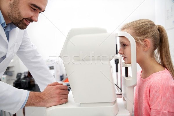 optician with tonometer and patient at eye clinic Stock photo © dolgachov