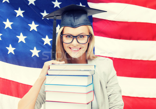 student in graduation cap Stock photo © dolgachov