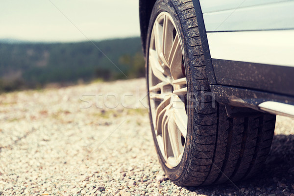 close up of dirty car wheel on cliff Stock photo © dolgachov