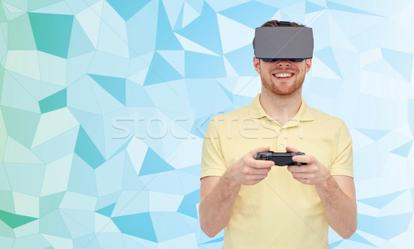 Felice uomo virtuale realtà auricolare gamepad Foto d'archivio © dolgachov
