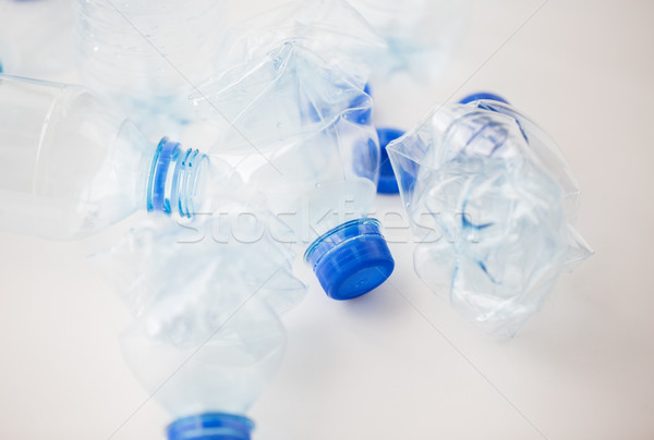 close up of empty used plastic bottles on table Stock photo © dolgachov
