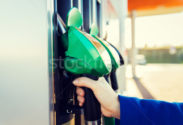 close up of hand holding hose at gas station Stock photo © dolgachov