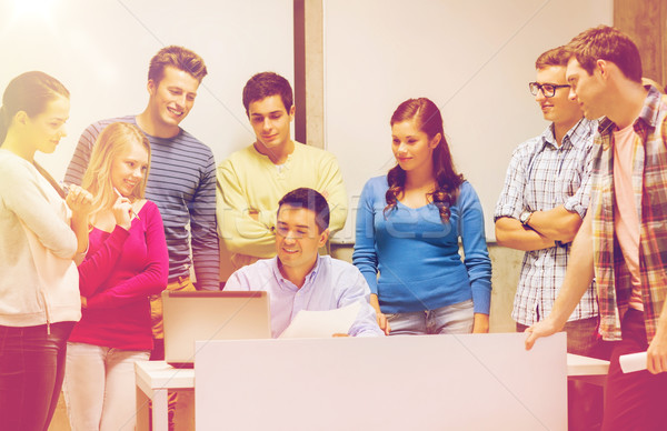 group of students and teacher with laptop Stock photo © dolgachov