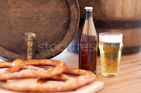 close up of beer barrel, glass, pretzel and bottle Stock photo © dolgachov
