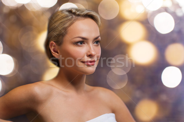 close up of young woman sitting in bath towel Stock photo © dolgachov