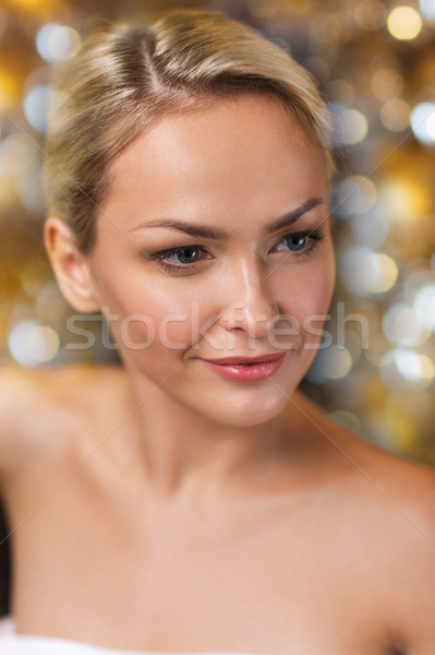 close up of young woman sitting in bath towel Stock photo © dolgachov