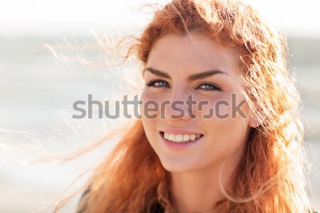 close up of happy young redhead woman face Stock photo © dolgachov