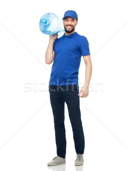 happy delivery man with bottle of water Stock photo © dolgachov