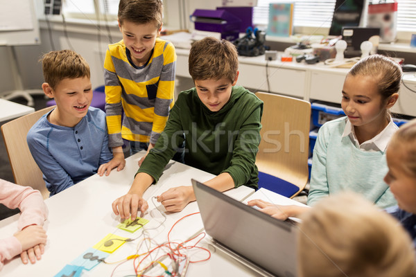 Stock photo: kids, laptop and invention kit at robotics school