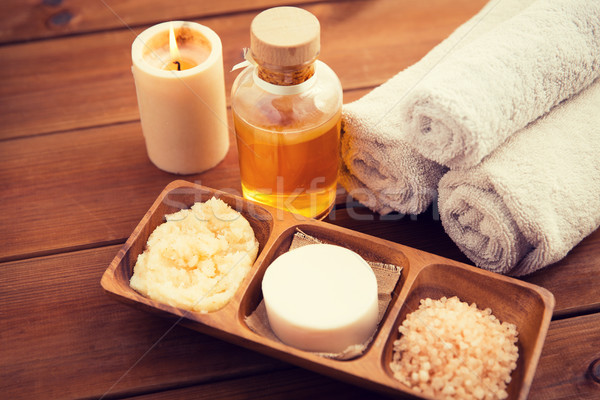 close up of natural cosmetics and bath towels Stock photo © dolgachov