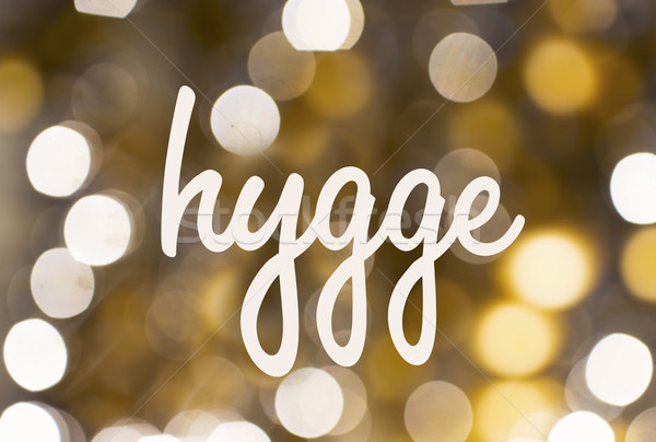 word hygge over blurred golden lights background Stock photo © dolgachov