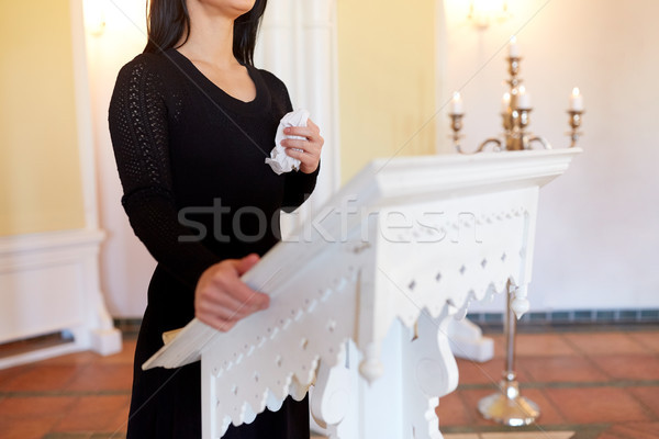 woman with wipe crying at funeral in church Stock photo © dolgachov