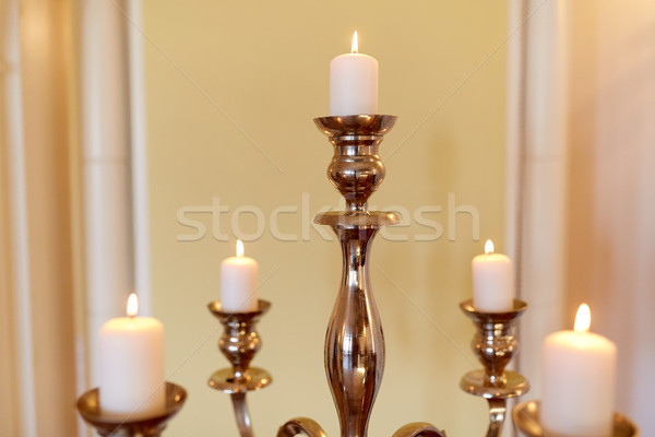 candles burning in church or palace Stock photo © dolgachov