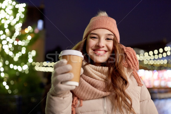 Stock photo: happy young woman with coffee at christmas market