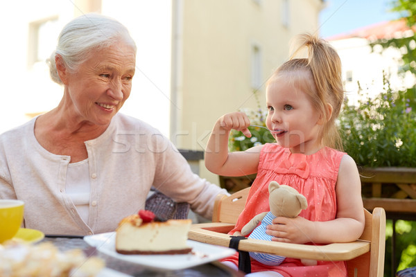 Petite fille grand-mère manger café enfance personnes [[stock_photo]] © dolgachov