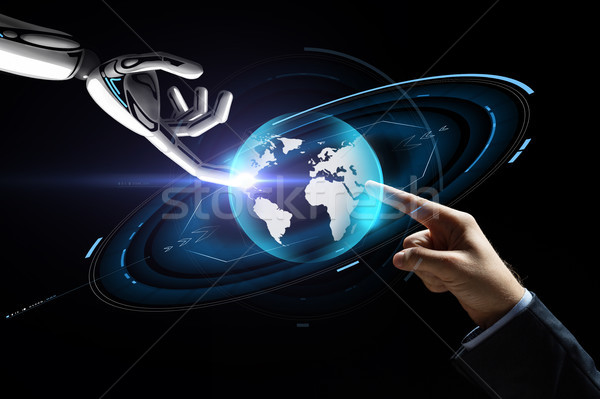 human and robot hand with virtual earth hologram Stock photo © dolgachov