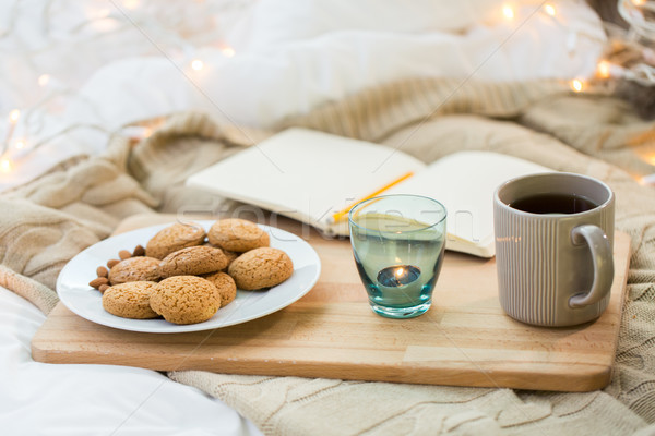 cookies, tea and candle in holder at home Stock photo © dolgachov