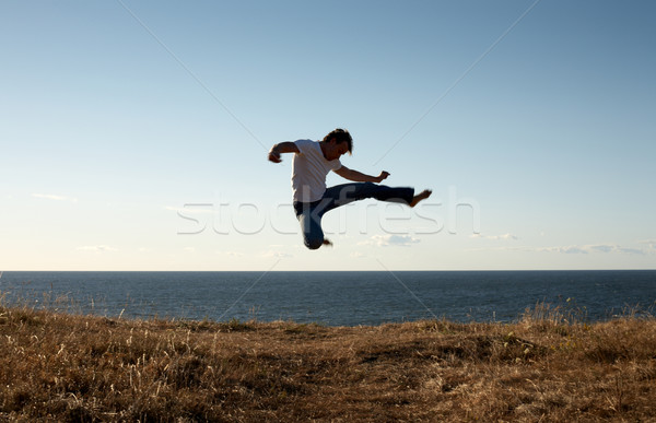 jump-kick Stock photo © dolgachov