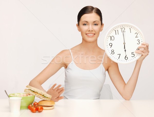 Stock photo: woman with big clock