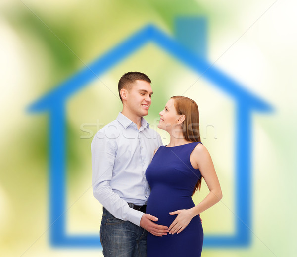 happy young family expecting child Stock photo © dolgachov