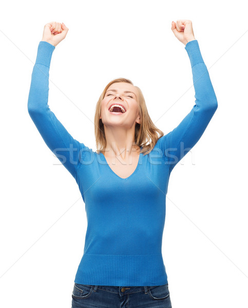 laughing young woman with hands up Stock photo © dolgachov