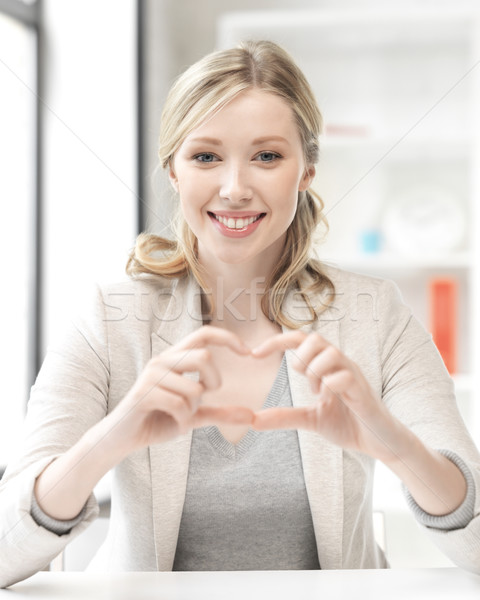 young woman showing heart sign Stock photo © dolgachov
