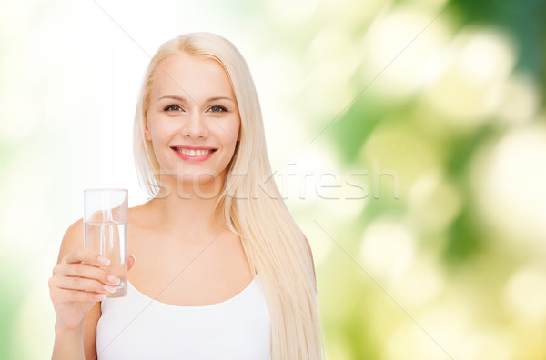 Genç gülümseyen kadın cam su sağlık güzellik Stok fotoğraf © dolgachov