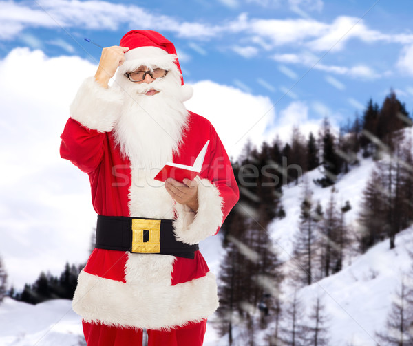 Man kostuum kerstman notepad christmas vakantie Stockfoto © dolgachov