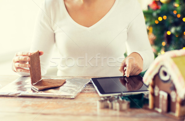 close up of woman making gingerbread houses Stock photo © dolgachov