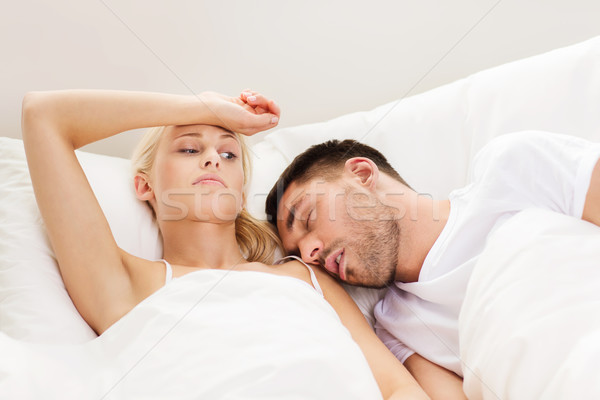 Pár alszik ágy otthon emberek család Stock fotó © dolgachov