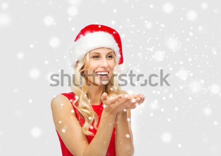 woman in santa hat taking selfie by smartphone Stock photo © dolgachov