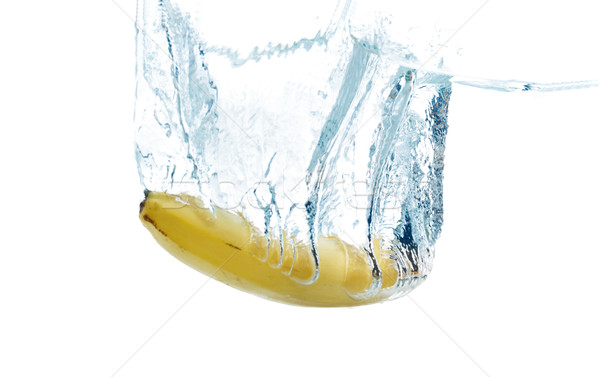 banana falling or dipping in water with splash Stock photo © dolgachov