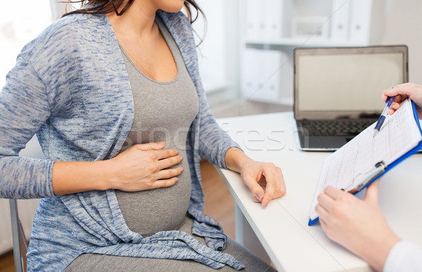 Stock photo: close up of doctor and pregnant woman at hospital