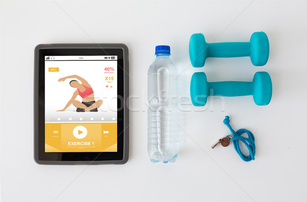 tablet pc, dumbbells, whistle and water bottle Stock photo © dolgachov