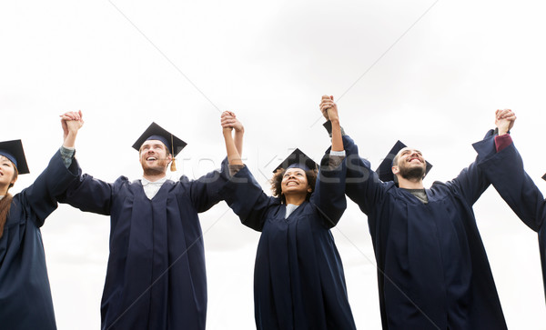 Foto stock: Feliz · estudiantes · solteros · graduación · educación