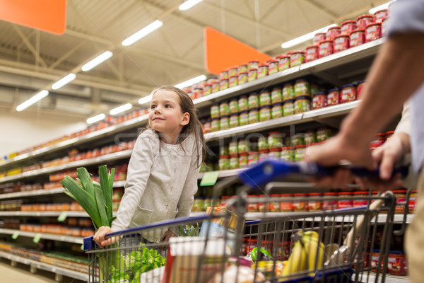 child with father buying food at grocery store Stock photo © dolgachov