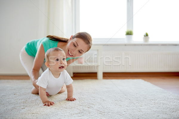 happy mother playing with baby at home Stock photo © dolgachov