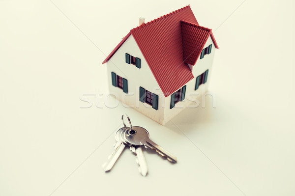 close up of home model and house keys Stock photo © dolgachov